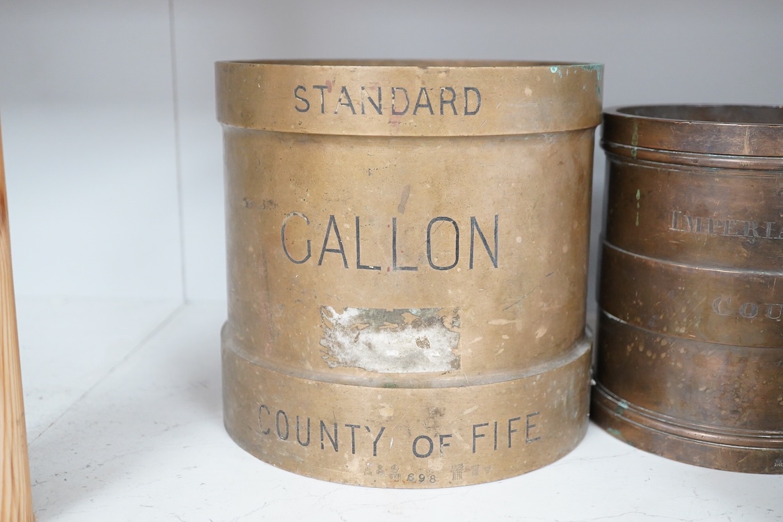 A set of seven early 20th century County of Fife official measures, comprising; a standard gallon, diameter 19.5cm, height 18.5cm, Imperial half gallon, Imperial quart, Imperial pint, Imperial half pint, Imperial gill, I